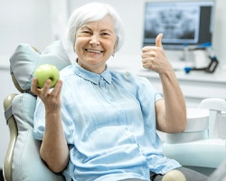 Woman with dental implants in Carrollton