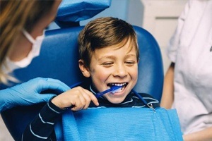 Little boy brushing his teeth