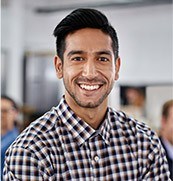 Smiling man in plaid shirt