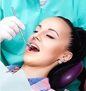 Woman receiving dental exam