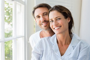 A man and woman smiling