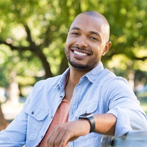 Smiling young man with dental implants in Carrollton