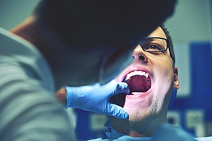 Man visiting his Carrollton dentist for a dental emergency in Carrollton