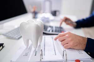 patient calculating cost of tooth extraction in Carrollton