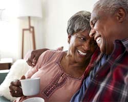 Couple smiling with dental implants in Carrollton