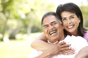 happy couple who have implant dentures in Carrollton