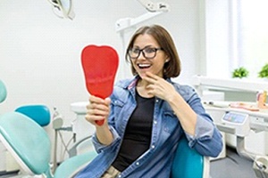 Woman after dental implant dentist in Carrollton