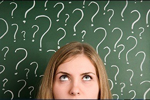 Woman's head surrounded by question marks