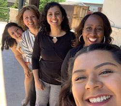 Staff smiling outdoors