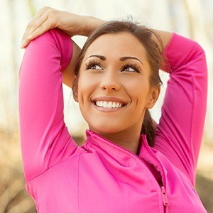 Woman outdoors stretchihng