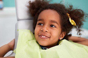 Smiling little girl in dental chair