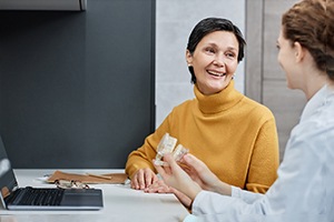 a woman speaking with her dentist