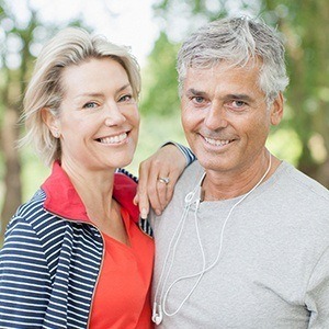 Smiling senior man and woman outdoors