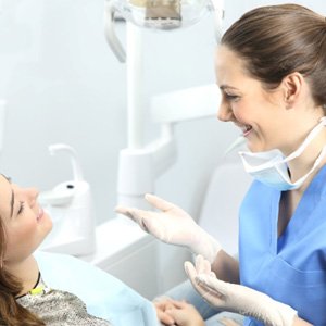 Dentist explaining a root canal in Carrollton