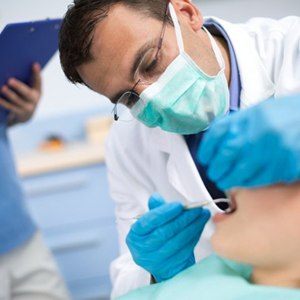 A dentist working on a patient.