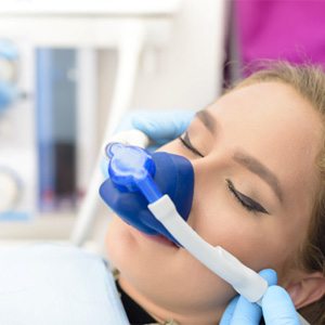 Woman relaxing with sedation dentistry in Carrollton