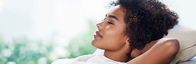 Relaxing woman with hands behind head