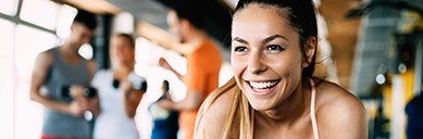 Smiling woman at the gym