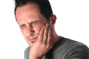 Man holding jaw in pain