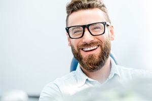 man smiling after getting veneers