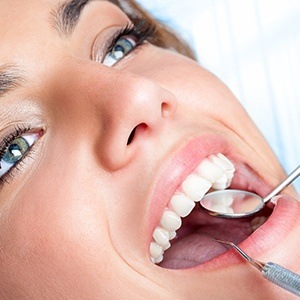 Woman receiving dental exam