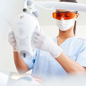 Dental assistant whitening teeth