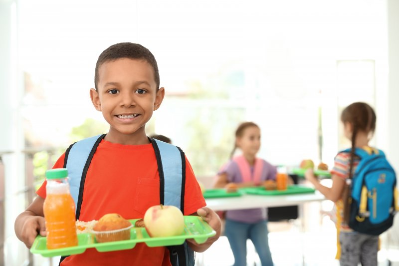 child enjoying school lunches in Carrollton