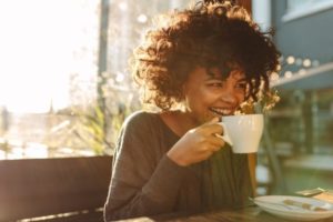 Woman enjoying a cup of coffee.