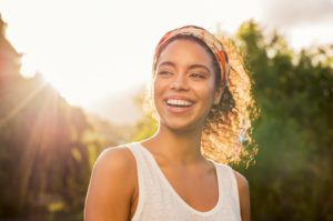 adult woman smiling outside 