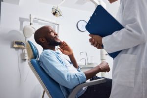 a patient talking to a dentist